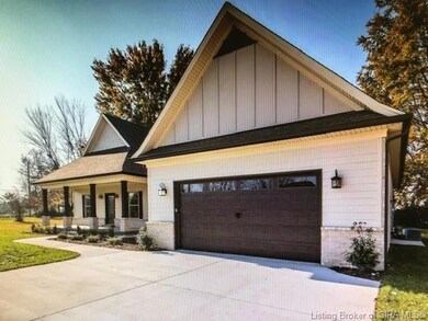 Two car garage with garbage can pad at right side 