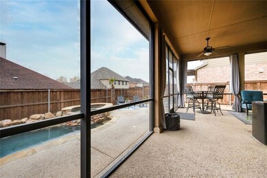 Huge screened in patio overlooking the pool and pa