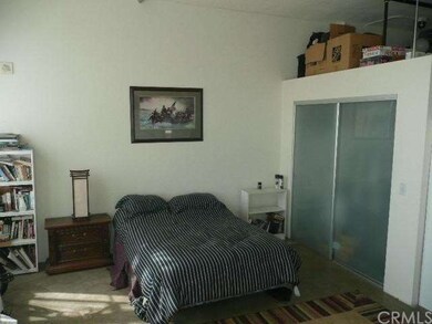 Sleeping area with closet and plenty of storage sp