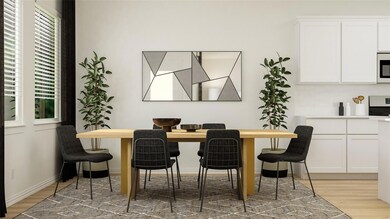 Dining space with hardwood / wood-style flooring