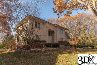 View of front of property featuring a front lawn and brick siding