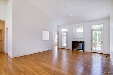 Double doors in the rear lead to the deck and rear
