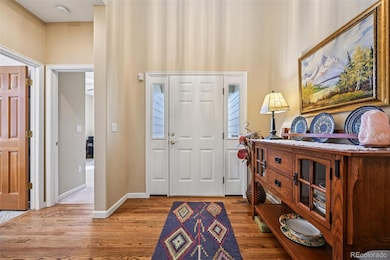 Front door and entry hall. Second bedroom and full bathroom on the left.