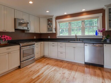 The kitchen area streams with...