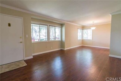 Living room and dining area with new flooring.
