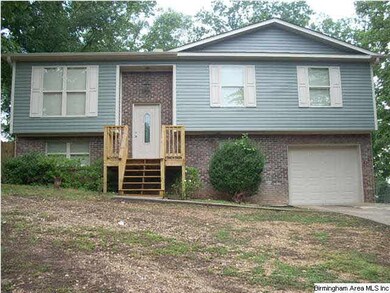The home features hardwood flooring, crown molding