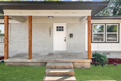 Entrance to property featuring a lawn