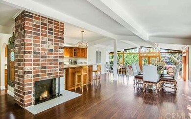 Open feel in main living room with fireplace. Bar 