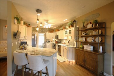 Breakfast Bar w/ Attractive Light Fixture overhead