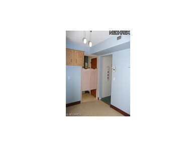 Entrance from kitchen to utility room with washer 
