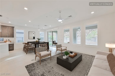 Virtually Staged Living room featuring recessed lighting, light tile patterned floors, and ceiling fan