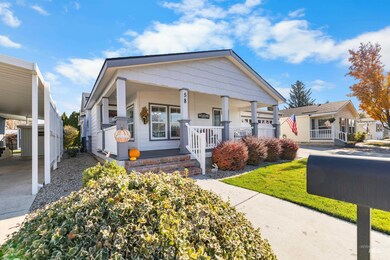 View of front of house featuring covered porch and a front yard