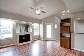 Living area has door to balcony and is open to the