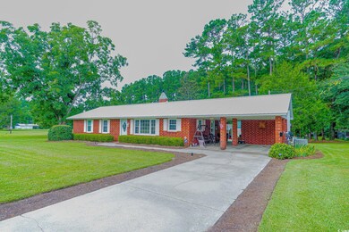 View of front of property featuring a front lawn a