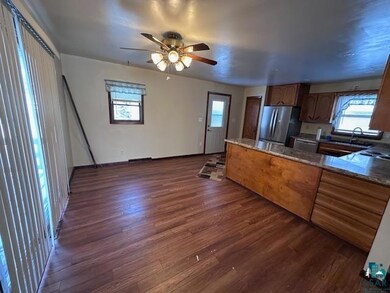 Kitchen featuring sink, stone countertops, stainle