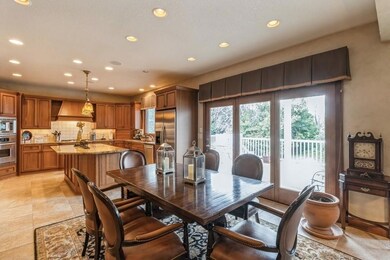 Eating area opens to family room kitchen & deck