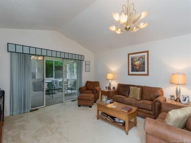 Living room connects to shaded screen porch.