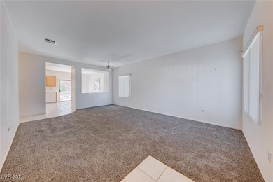 Empty room featuring light colored carpet, ceiling