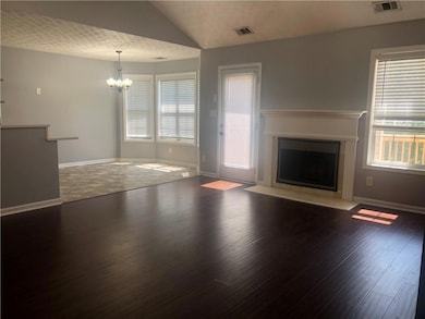 Unfurnished living room with baseboards, a firepla