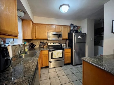 Kitchen featuring sink, stainless steel appliances