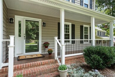 Lovely front porch with new rails and stained concrete floor!