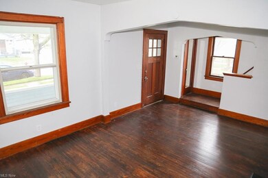 Front room looking towards the door and upstairs (