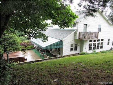Exterior Back. View from the upper acreage. Patio 