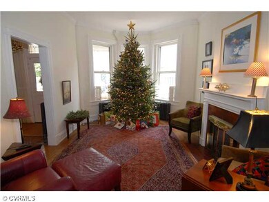Living Room - What a beautiful & welcoming room with it's 10' ceilings, fireplace w/ mantle, lot's of natural light & pocket door between living room & dining room.