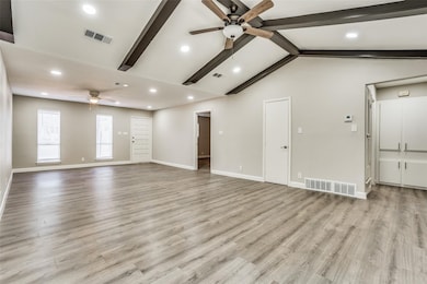 Unfurnished living room featuring a ceiling fan, light wood-type flooring, and recessed lighting