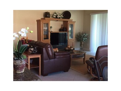 Open Concept, Tiled Living Room with Sliders to L-
