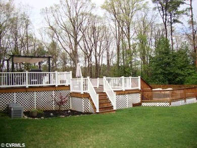Exterior Back - 3-tiered deck with above gorund pool (vinyl railings)