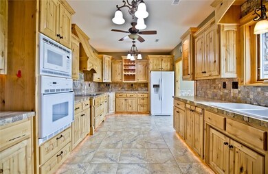 Kitchen with Custom Cabinets made out of Knotty Al