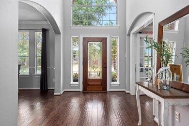 The grand entry is full of light! As you walk through the door, the formal dining room is on the right and the office/study is located on the left.