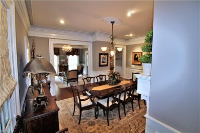 Formal Dining Room with Custom Art Lights & Cove L
