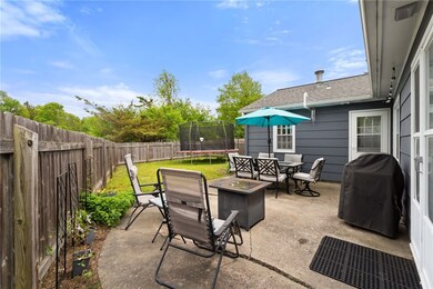Patio and fenced in backyard