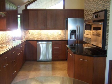 granite tops, custom cabinets and backsplash