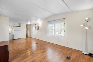 Unfurnished living room with light hardwood / wood