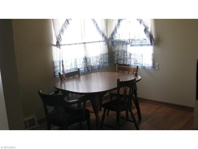 Large eating area off the kitchen. Could accomodate larger furniture.