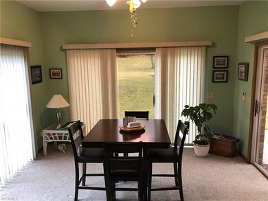 Sunroom with three sliders to the patio and back y