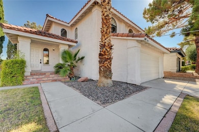 Mediterranean / spanish-style house with a tiled r