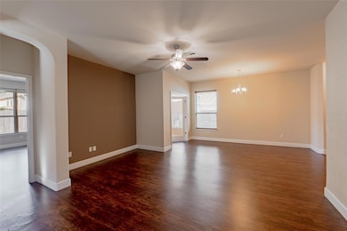 Spare room with dark wood-style flooring, ceiling