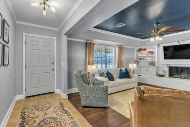 Living room featuring tile patterned flooring, bui