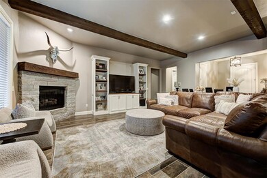 Living room featuring custom built-ins and a beaut