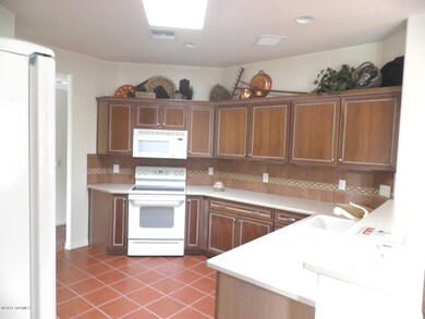 Upgraded kitchen with cherry cabinets