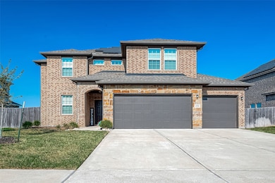 This charming two-story home boasts a warm and inviting exterior, featuring a tasteful blend of brick and stone. The sturdy construction exudes classic elegance, while the well-maintained facade adds to its welcoming appeal.