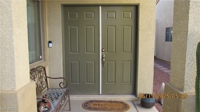 Entrance to property featuring stucco siding