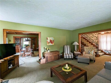 Living Room with Carpet over Wood Floor