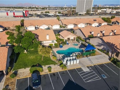 Aerial view of property's location featuring a pool