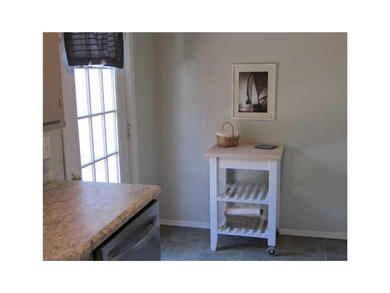 Kitchen. Door to deck