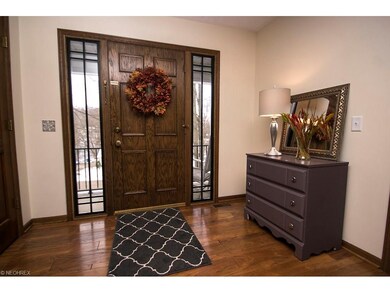 The foyer entry is warm and welcoming, with hard w